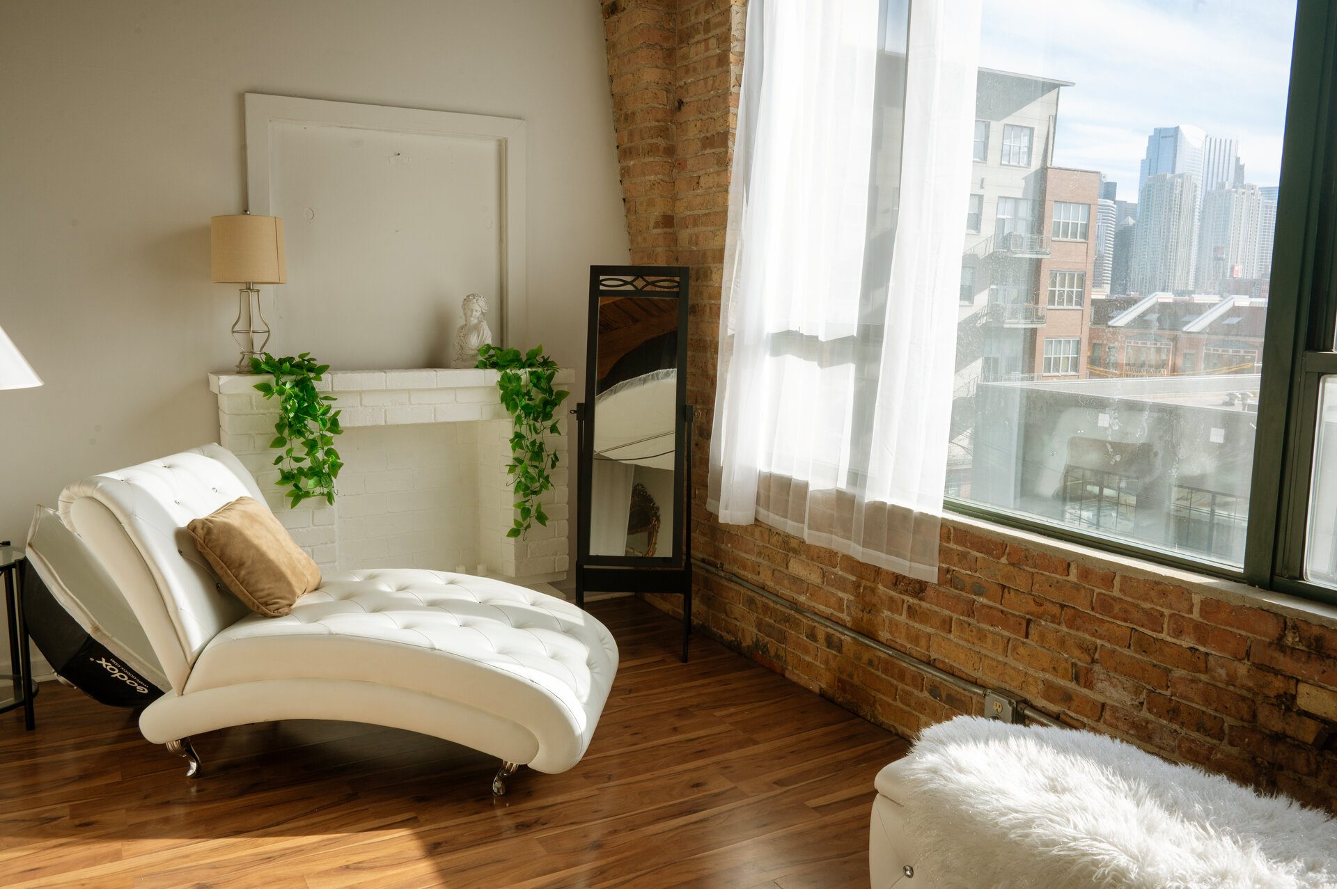 Empty studio interior with Chicago skyline view, West Loop photography studio