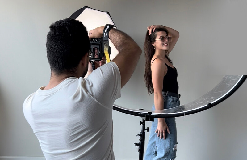 Photographer guiding a model during a portrait photography session, Chicago